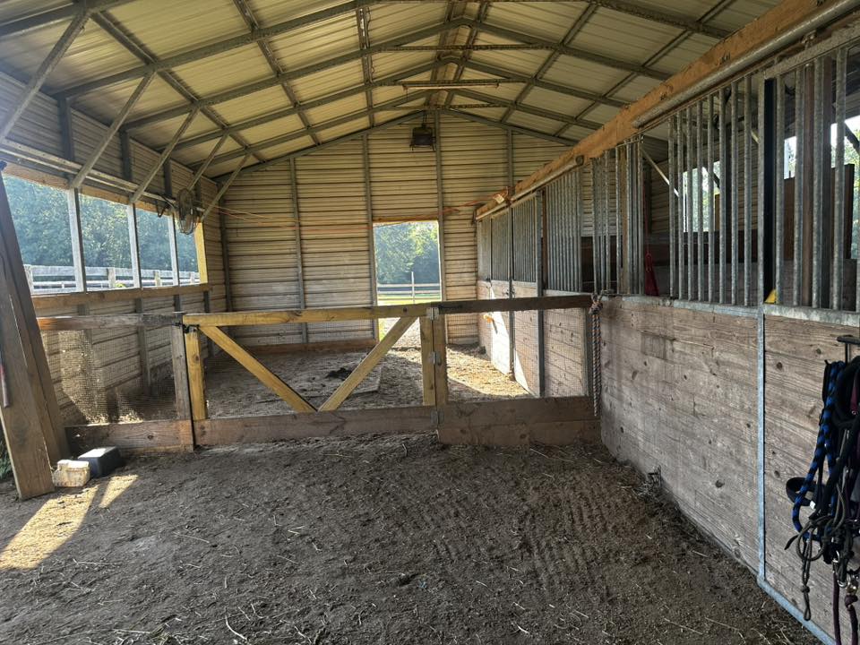 Oversized 14x16' stall with a fan. Two 10x11' stalls are accessible from the inside of the oversized stall or pasture-side doors in the main pasture