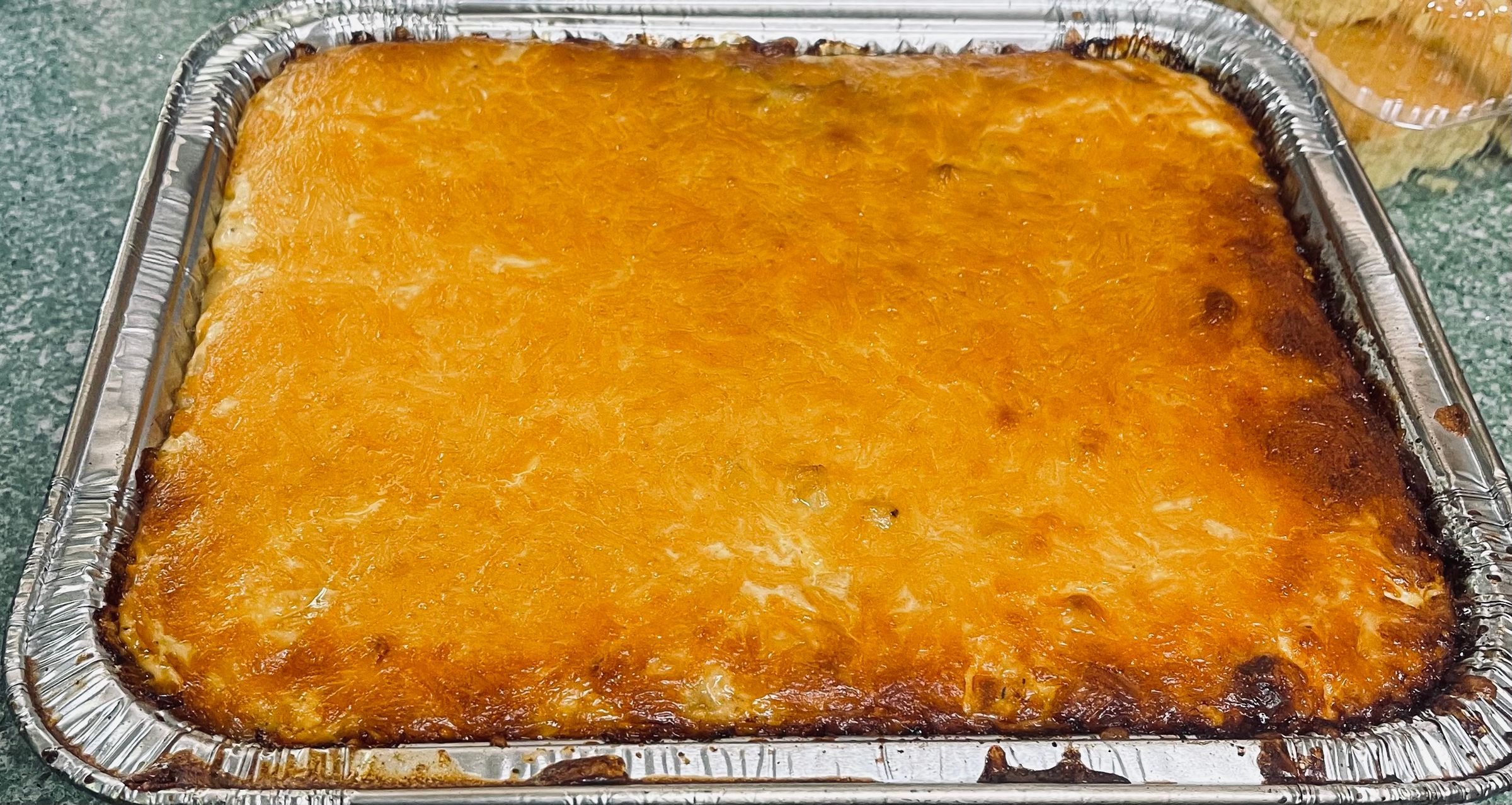 Smoked Mac and cheese golden brown cheesy and delicious
