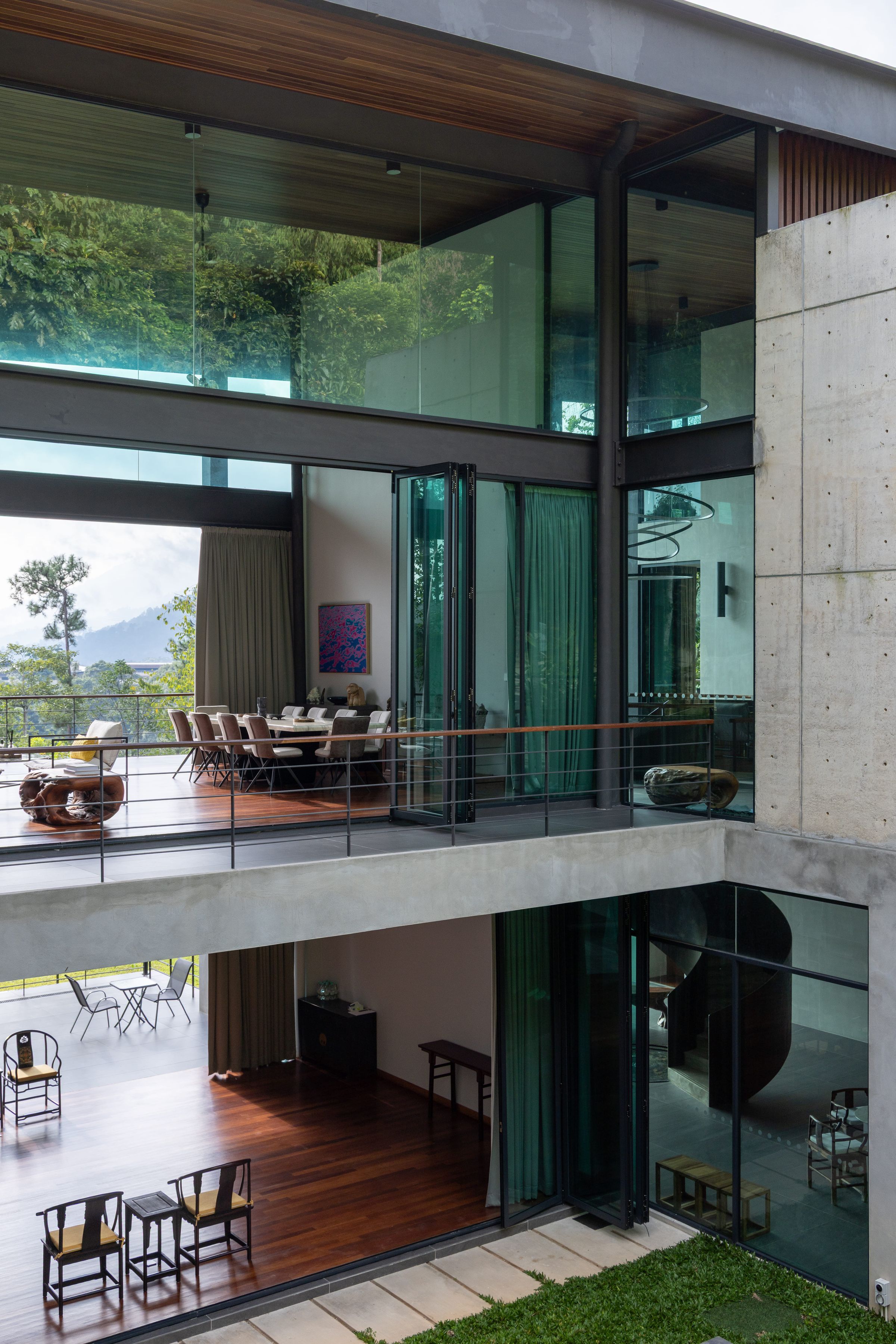 Architectural exterior of the two-storey SereneNest villa amid tropical greenery
