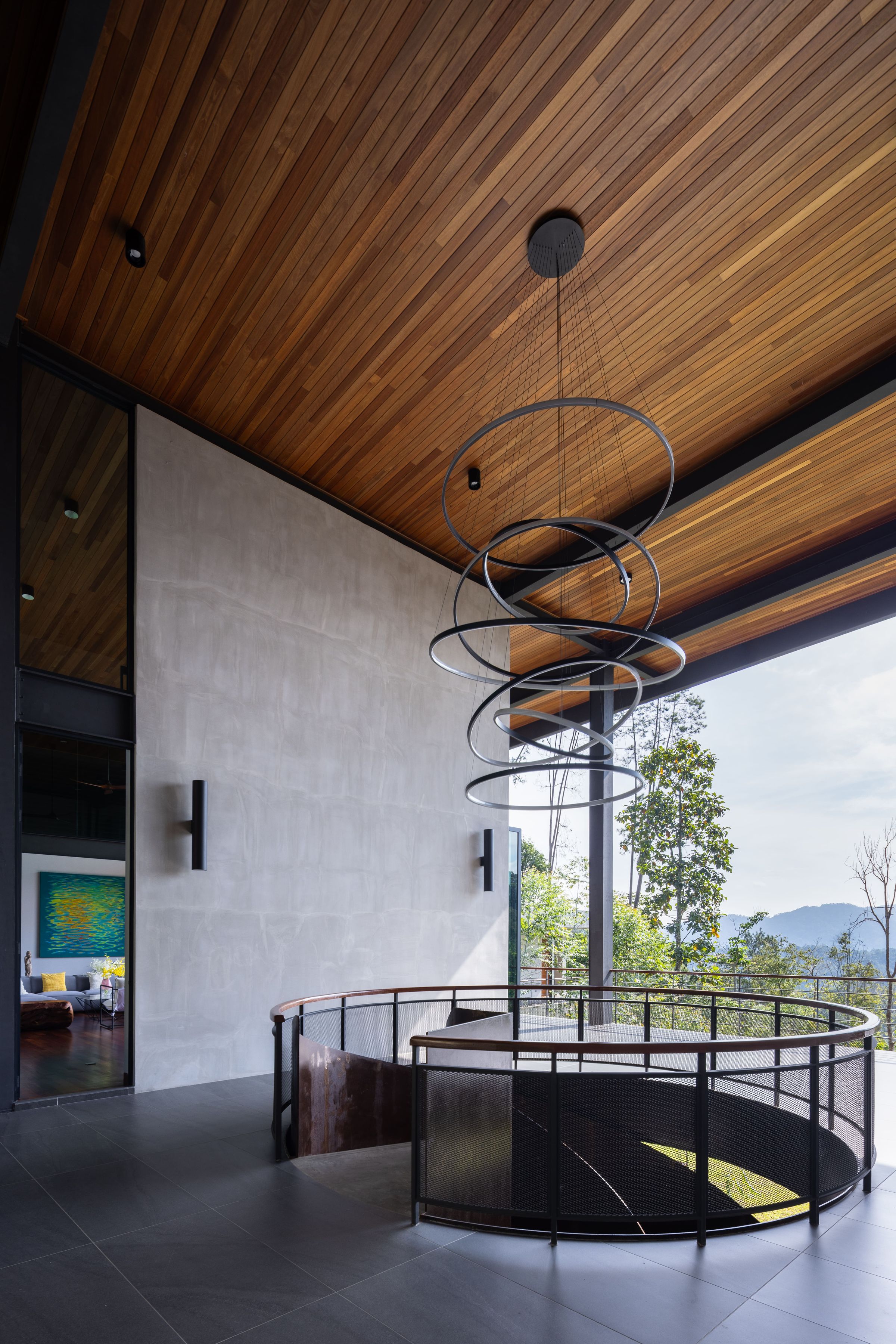 Pavilion-style lounge at SereneNest with timber ceiling, spiral light and a balcony deck