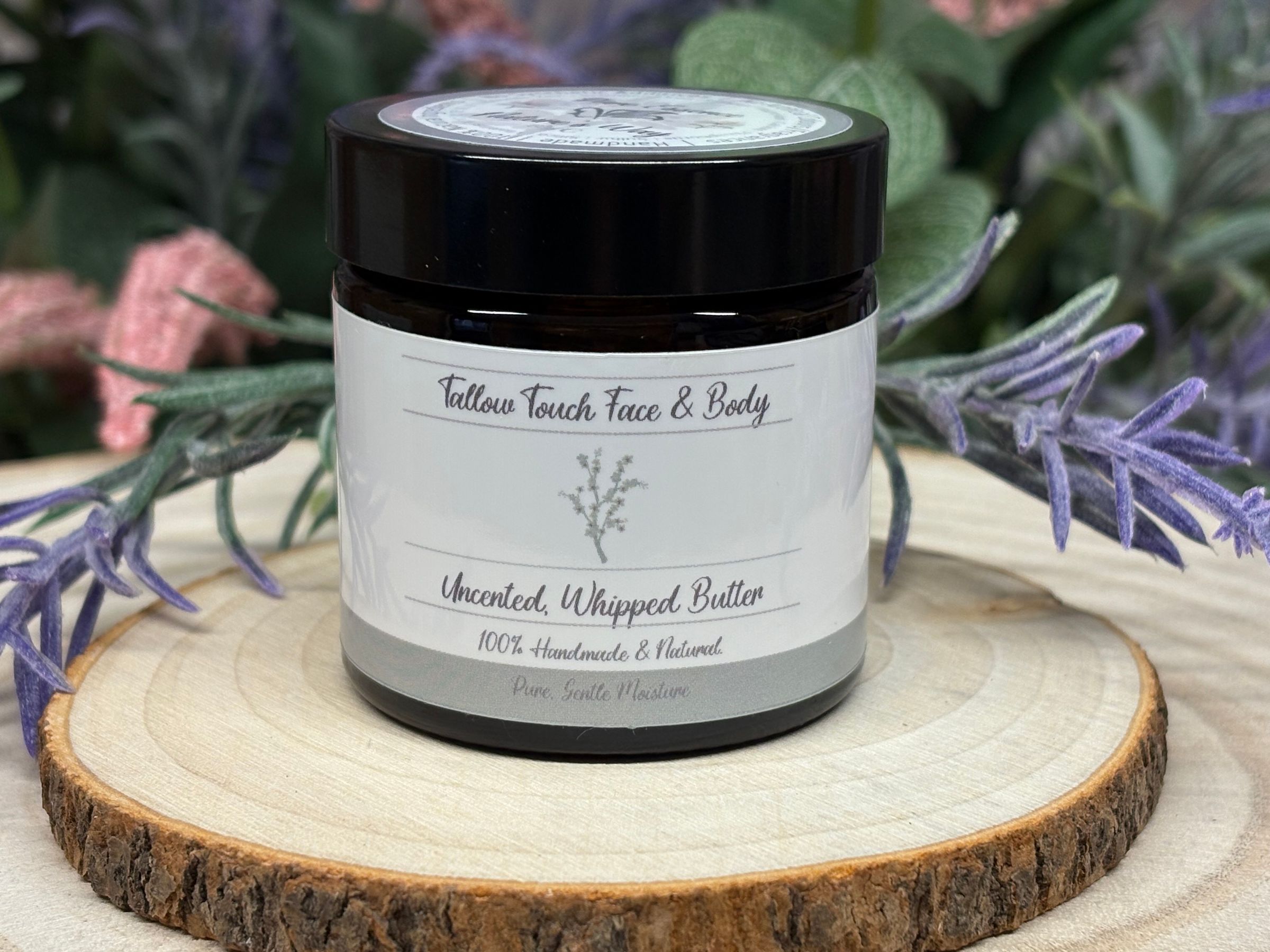 Tallow Touch Face & Body Butter is the ultimate all-in-one moisturizer for simplicity and nourishment. Grass-fed tallow provides intensive support for the skin’s natural barrier, while shea butter and calendula-infused jojoba add soothing hydration for both face and body. Comfrey-infused olive oil, argan, castor, and squalane replenish essential fatty acids, vitamins, and antioxidants for lasting softness and resilience. Arrowroot ensures a smooth, breathable finish, while rosemary extract and vitamin E deliver extra protection against stressors. The unscented or subtle herbal fragrance leaves skin feeling fresh, not overpowering, making this formula ideal for daily use, sensitive complexions, or anyone wanting uncomplicated, effective care. Tallow Touch Face & Body Butter absorbs quickly, comforts dry and rough spots, and restores radiant suppleness from head to toe. Suitable for all skin types and ages, it’s the perfect choice for minimalist routines and those seeking healthy.