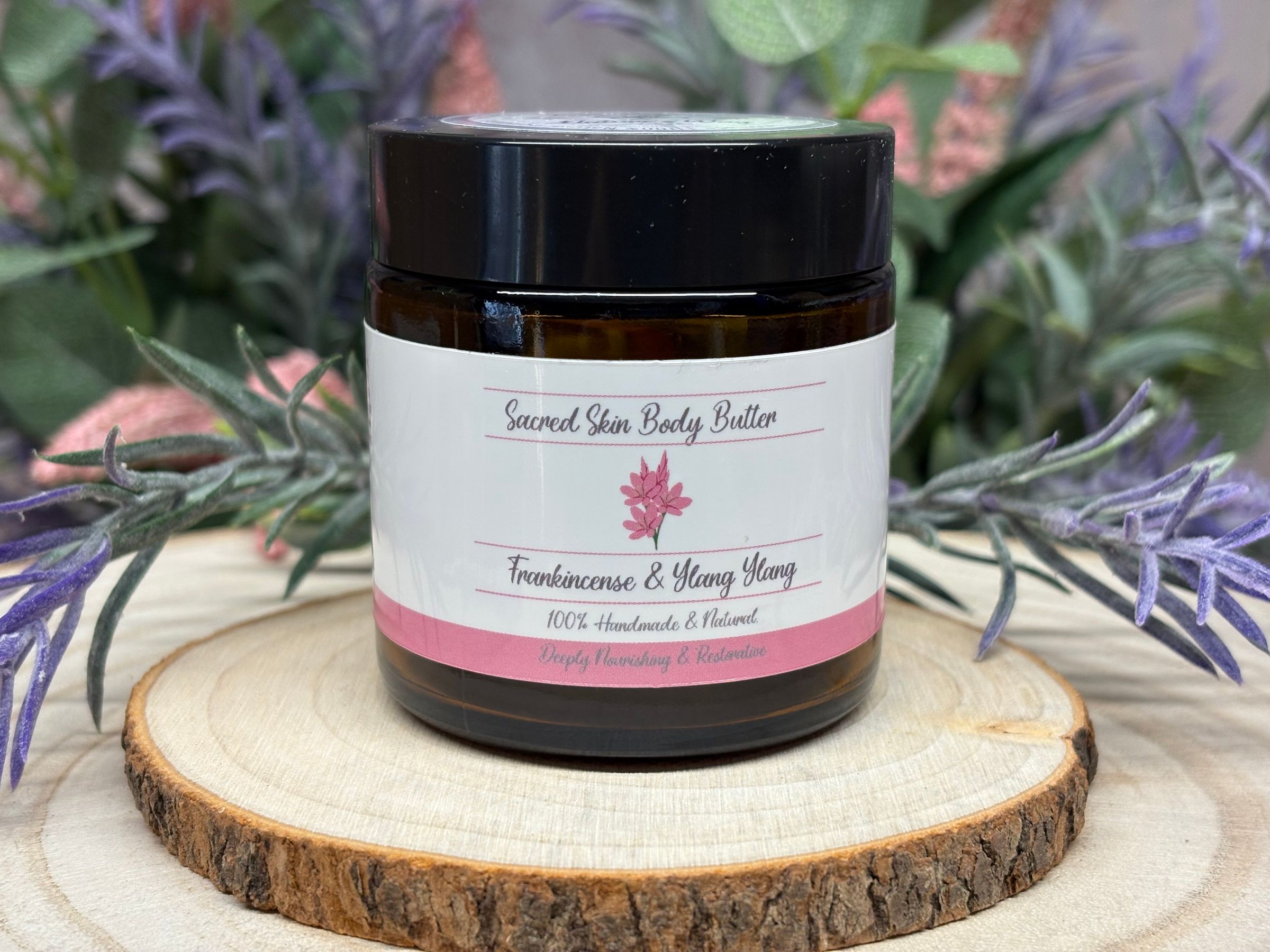 Wrap yourself in luxury with Sacred Skin Body Butter, a deeply restorative blend for full-body repair and luminous comfort. Grass-fed tallow, shea, and comfrey-infused olive oil are joined by calendula-infused jojoba, coconut oil, and squalane to bring enduring hydration and support for dry, stressed, or mature skin. Castor oil enhances softness and barrier resilience, while arrowroot ensures a velvety, non-greasy finish that absorbs quickly and keeps your skin fresh. Frankincense and ylang ylang lend gentle floral, resinous notes, boosting antioxidant protection and supporting skin renewal. Rosemary extract and vitamin E further fortify against daily wear. Designed for overnight renewal or daily use after showering or exposure, Sacred Skin Body Butter soothes irritation and envelops your body in a comforting, grounding aroma. Experience visibly smoother, more resilient skin, nourished by the wisdom of botanicals, every time you use Sacred Skin Body Butter.