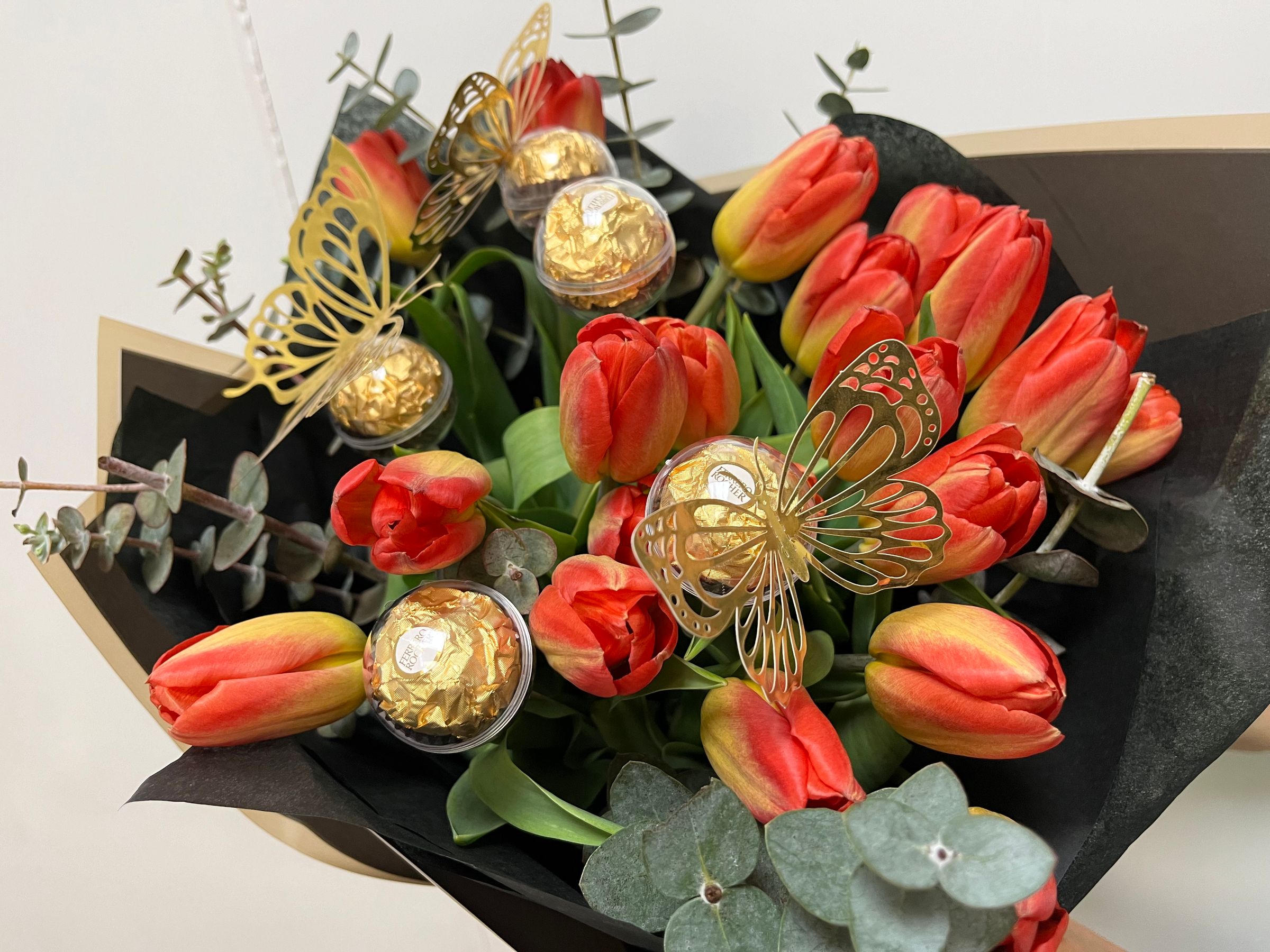 Tulips, Eucalyptus, and Hazelnut Ferrero Rochers with Foil Butterflies
