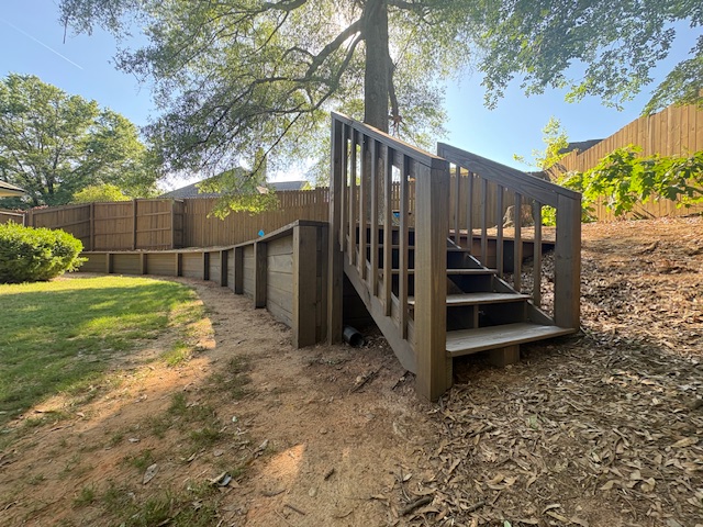 Fence, retaining wall and stairs stained & sealed (Barnwood) Columbus, Ga