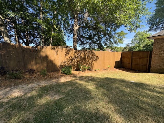 Fence, retaining wall and stairs stained & sealed (Barnwood) Columbus, Ga