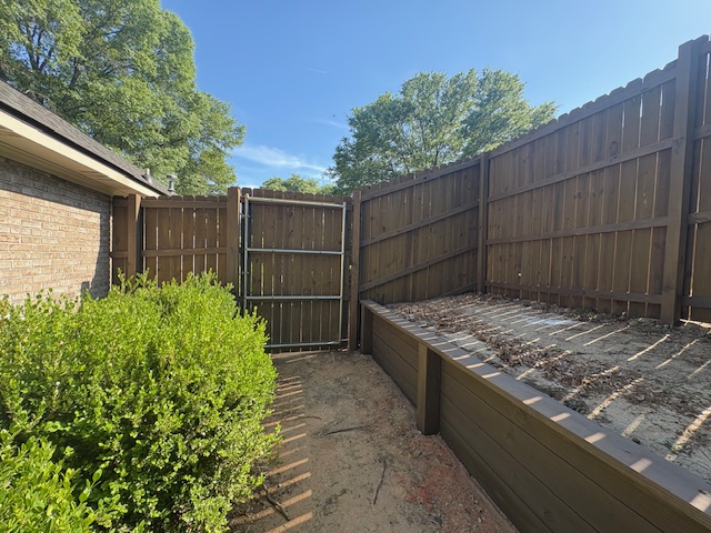 Fence, retaining wall and stairs stained & sealed (Barnwood) Columbus, Ga