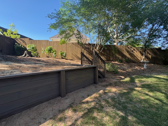 Fence, retaining wall and stairs stained & sealed (Barnwood) Columbus, Ga