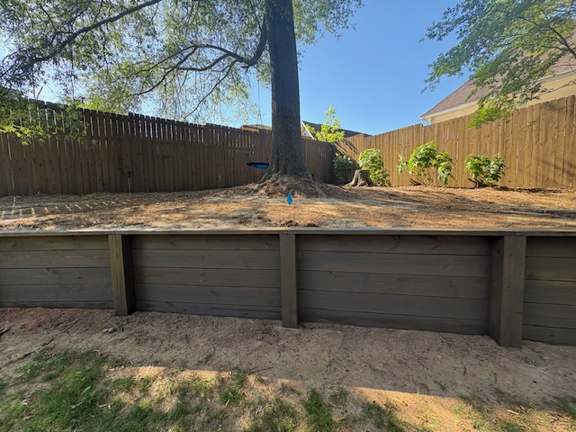 Fence, retaining wall and stairs stained & sealed (Barnwood) Columbus, Ga
