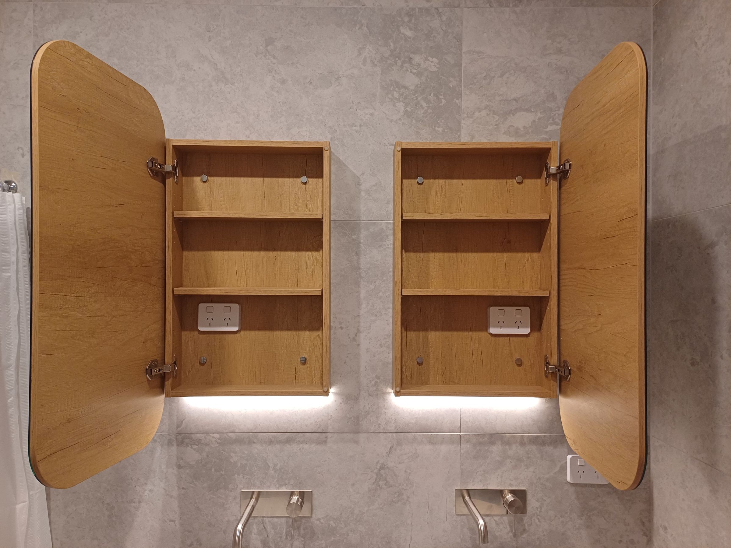 Tiling complete, Shaving cabinets installed