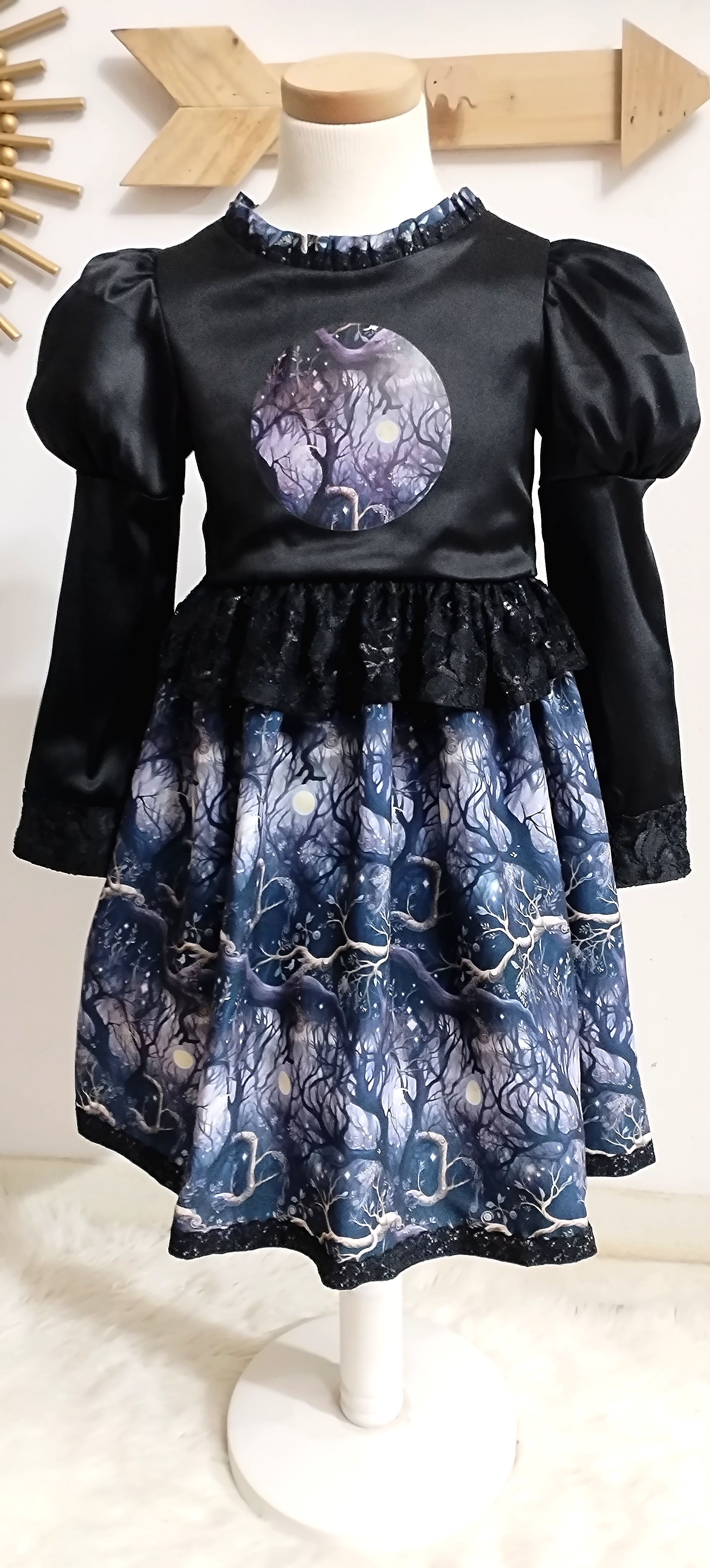 Black satin and soft peach skin fabric dress with a black broderie anglaise petticoat