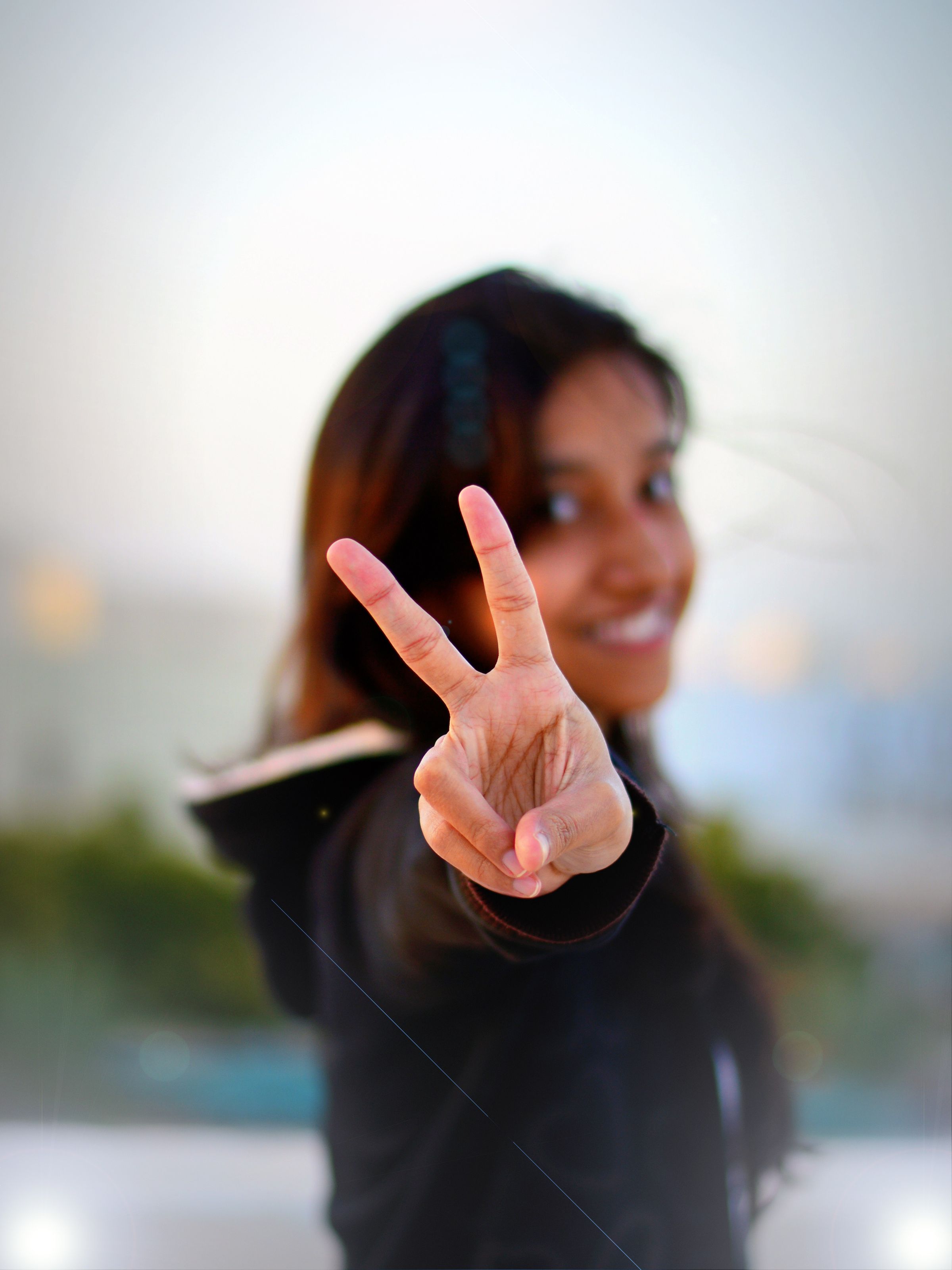 Peace Sign – Capturing joy in a simple gesture.
