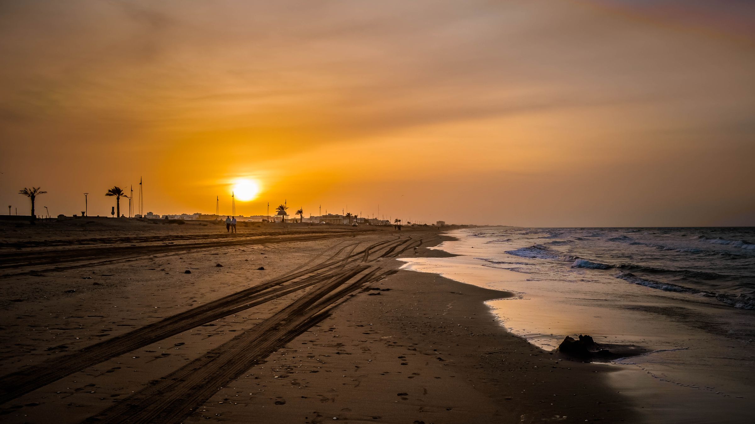 Sunset melting into the horizon. (Seeb, Oman)