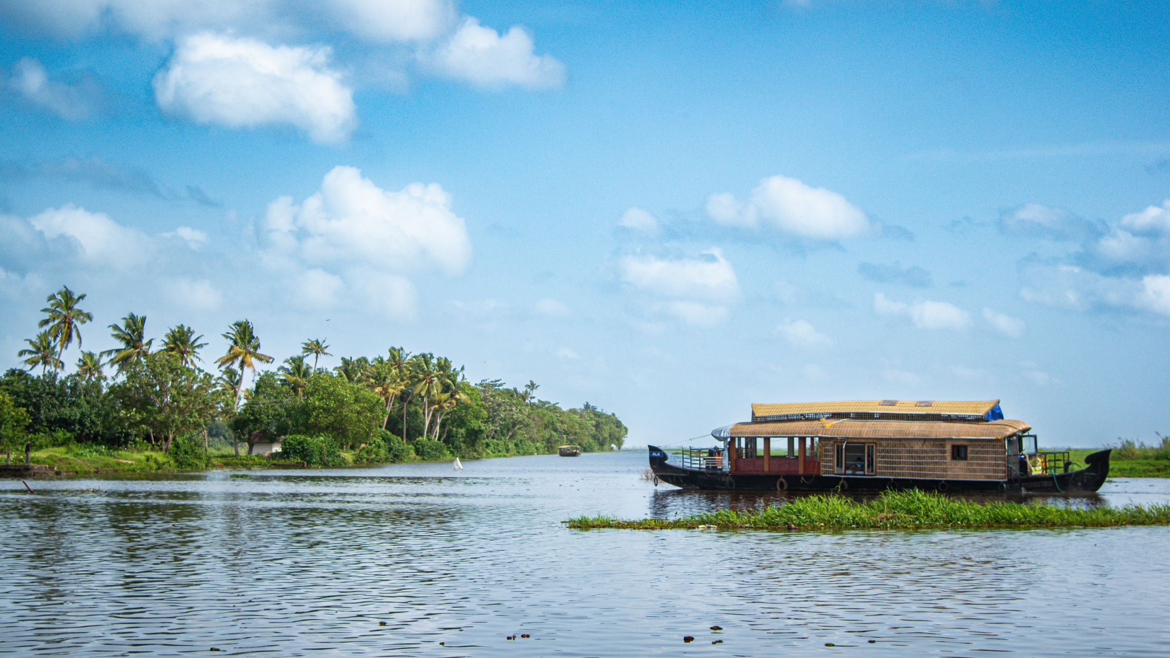Kerala’s houseboats and tranquil lagoons. (Kumarakom, Kerala)