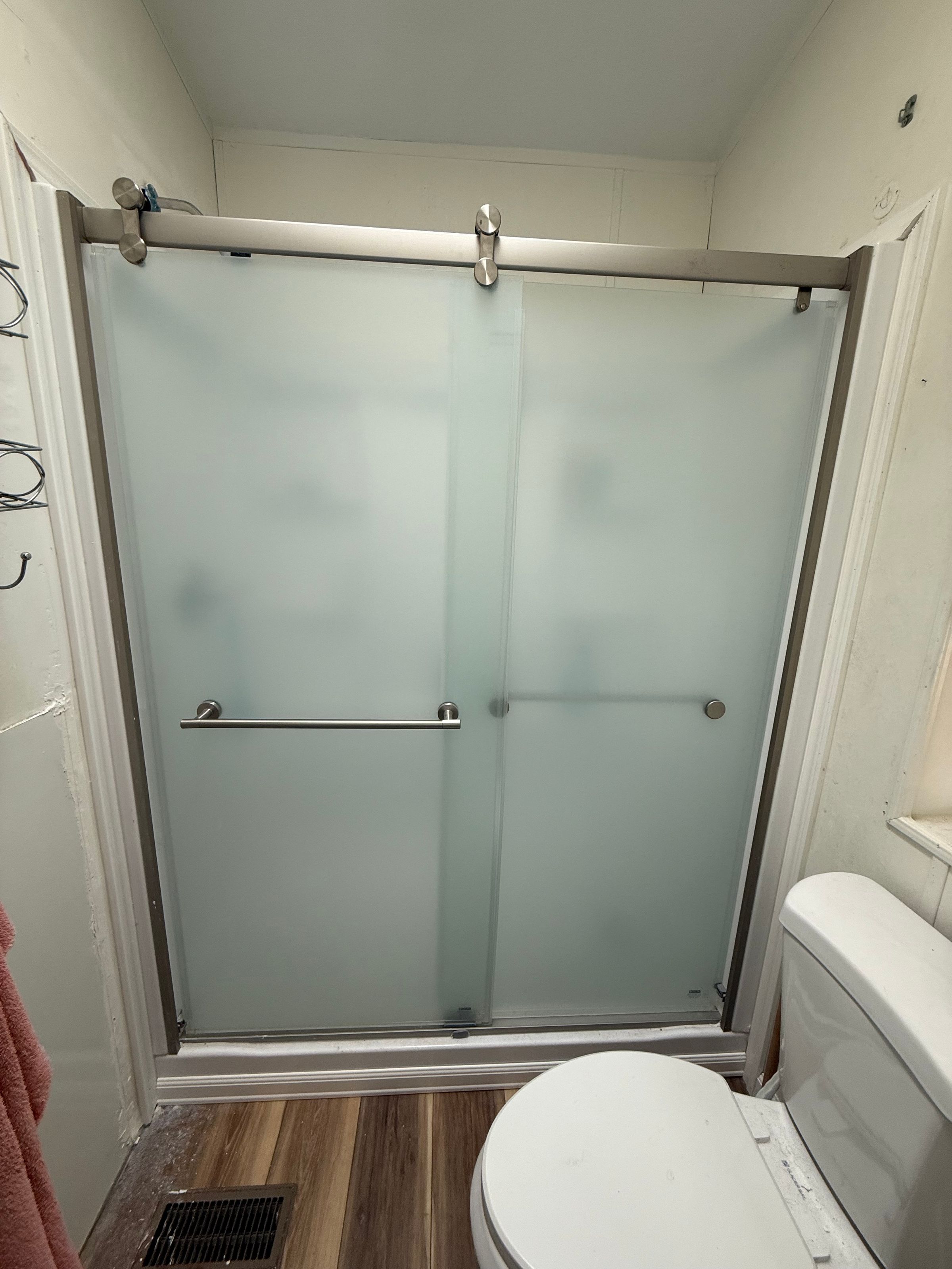 Converted to a stand up shower with sliding glass barn door! Way bigger and looks so amazing 