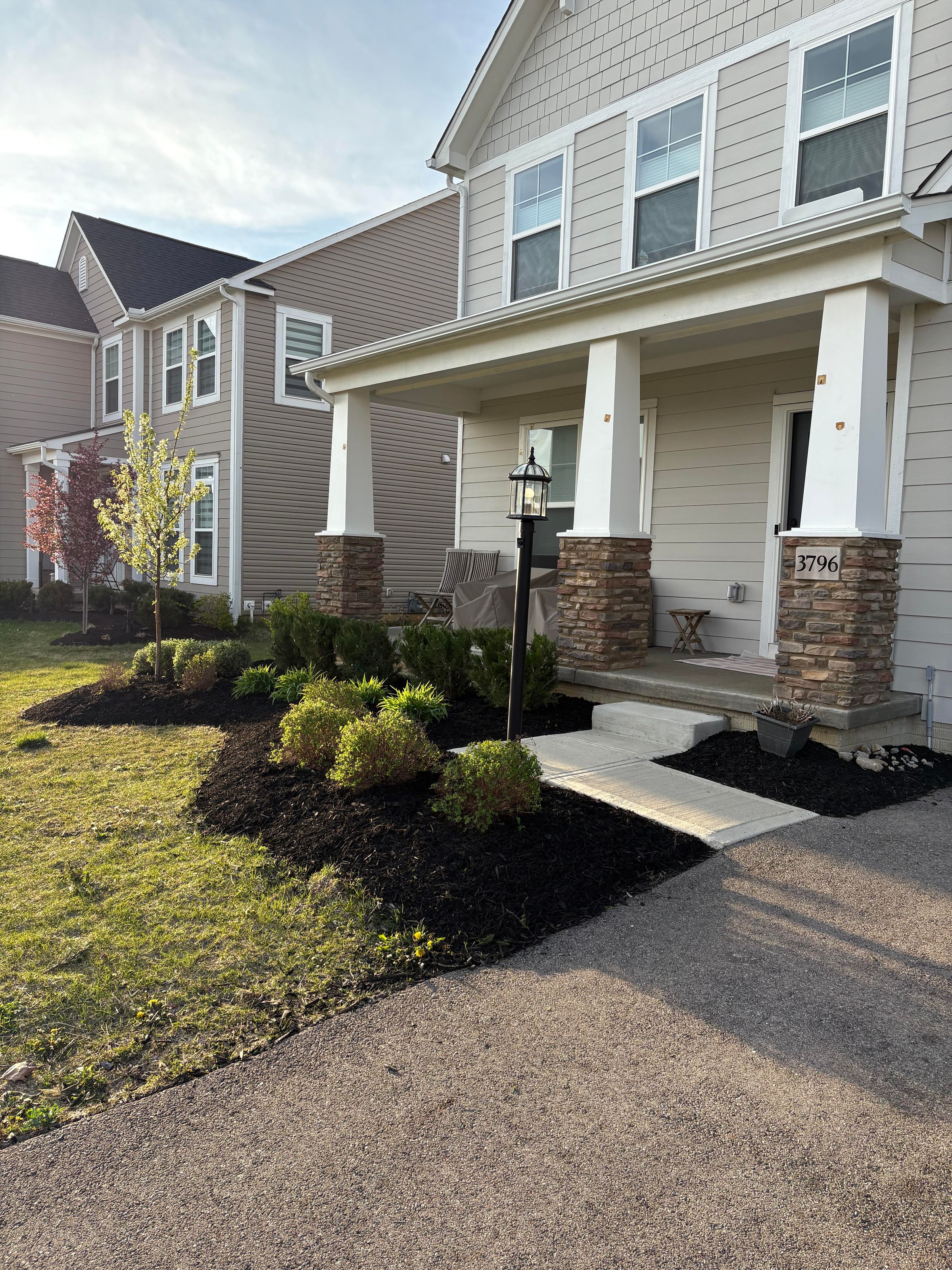 The Front row of bushes and the Darker Green ones in the back were trimmed along with a weeding and mulch job.