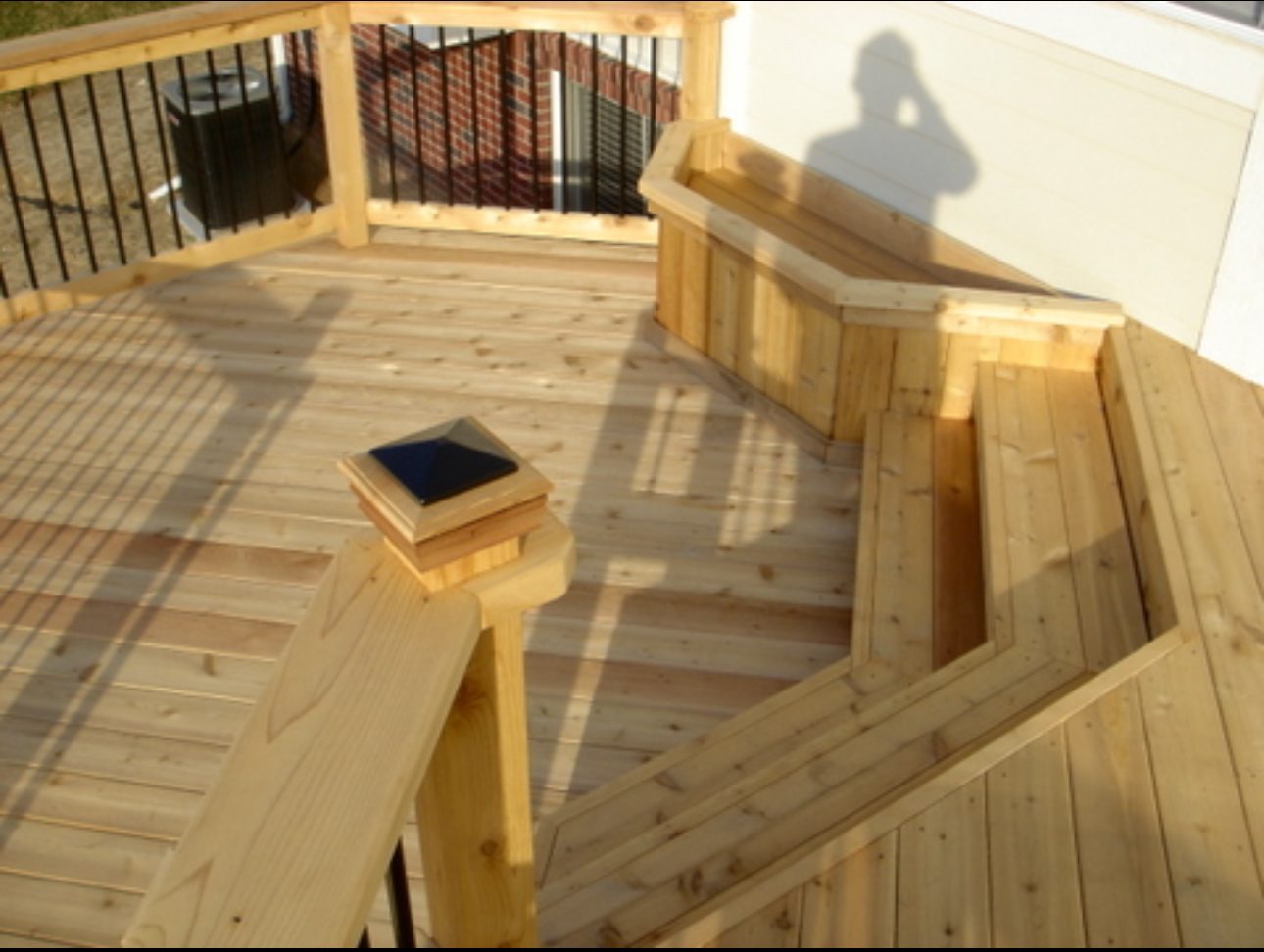 Elevate Your Outdoor Living Experience with Custom Craftsmanship  This image showcases the meticulous craftsmanship and thoughtful design that defines our deck building services.