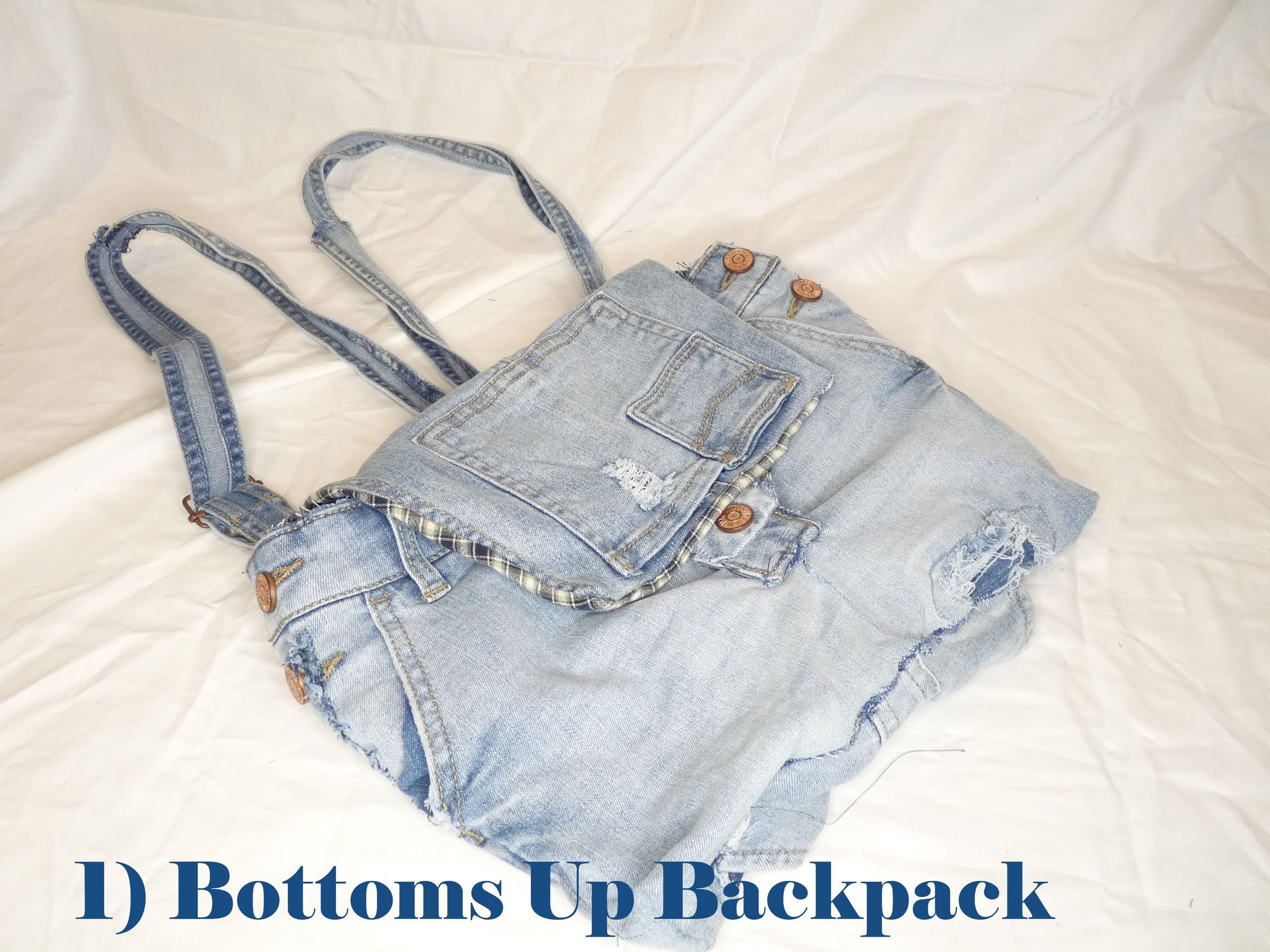 This backpack is made from recycled jeans never worn (never sold till sold for scrap material). Simple cute back pack with actual pockets.