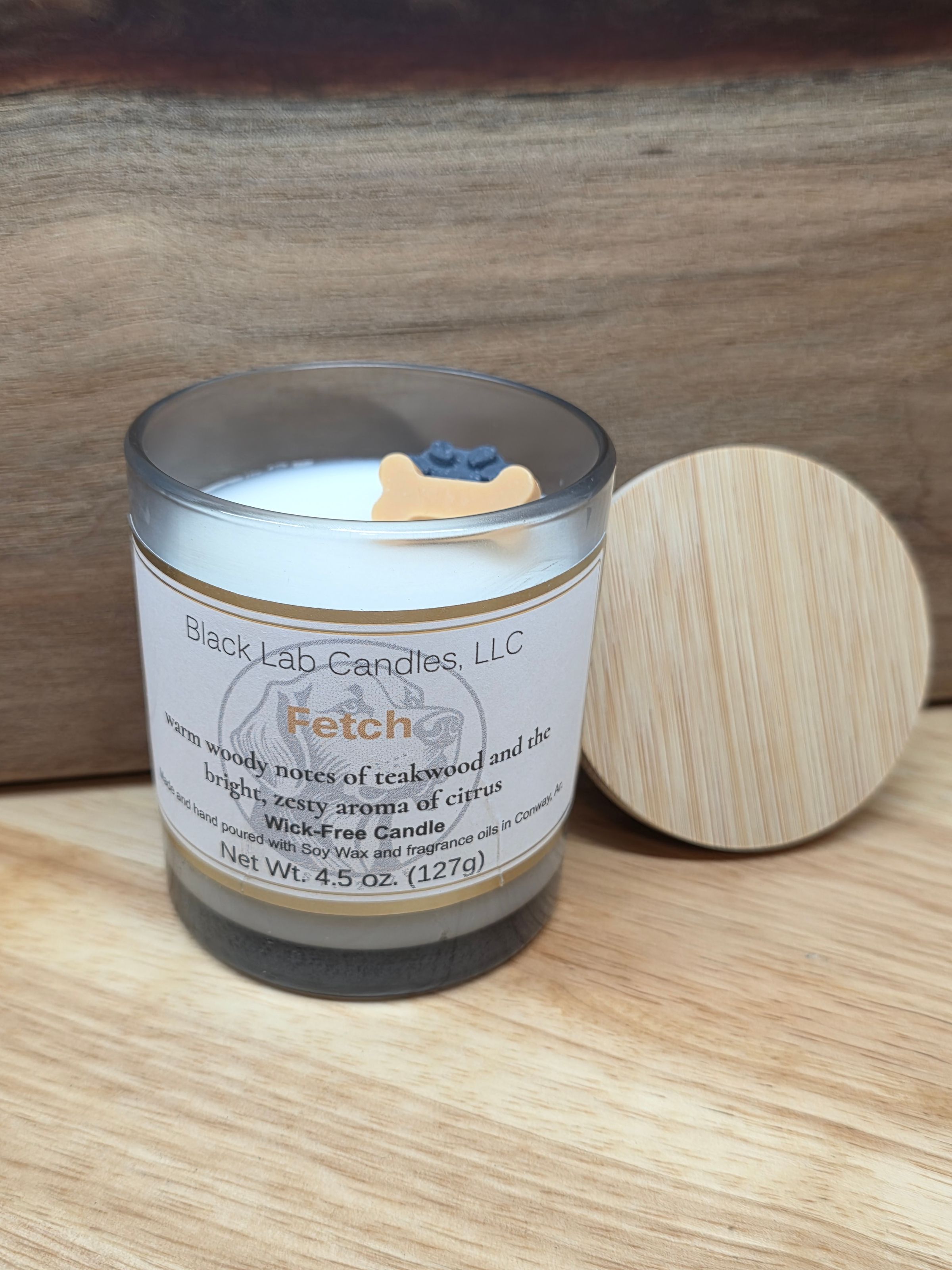 Fetch- warm woody notes of teakwood and the bright, zesty aroma of citrus