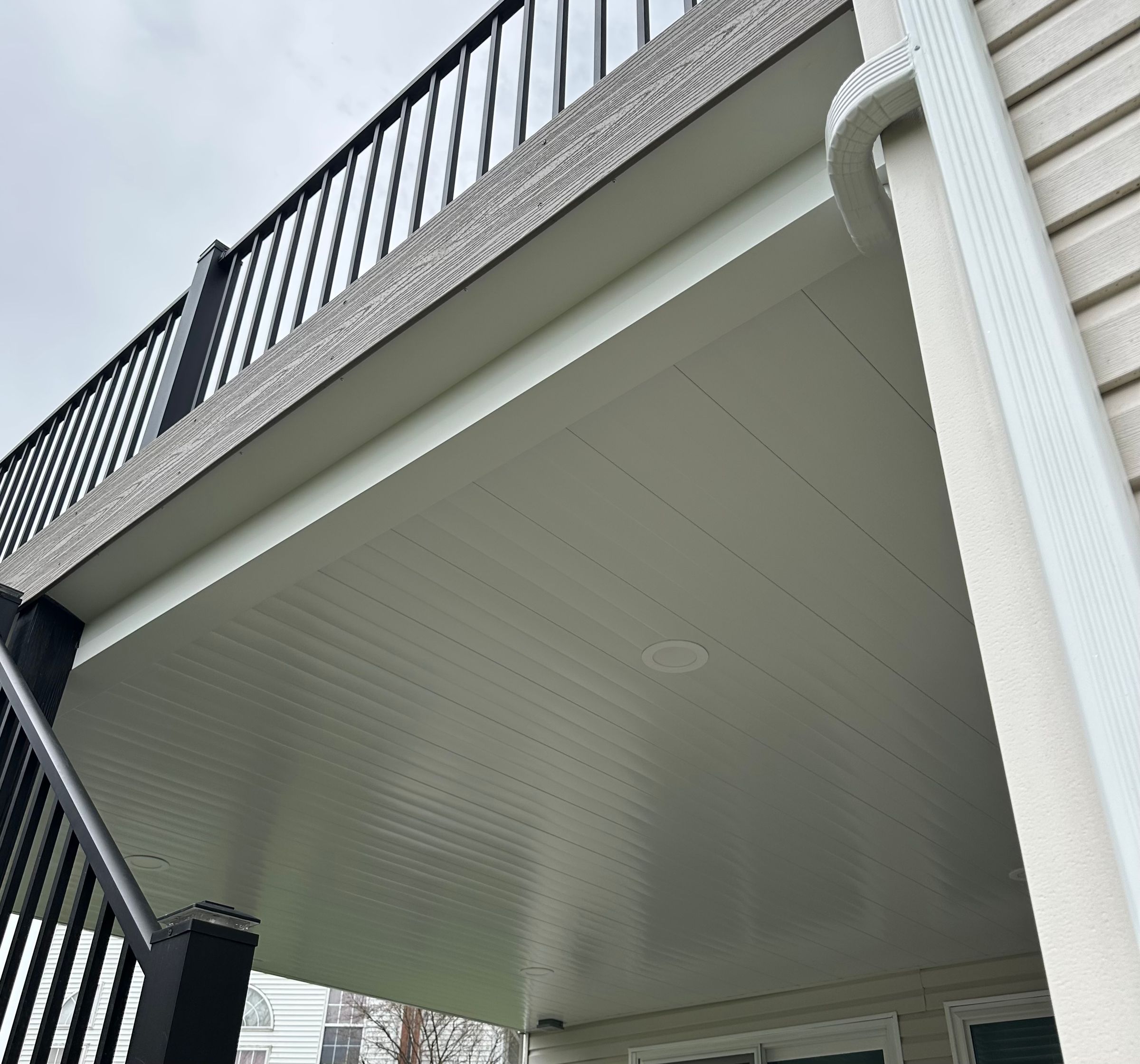 Waterproof under your deck with our system, we can tie into existing downspouts which goes to an underground tube.