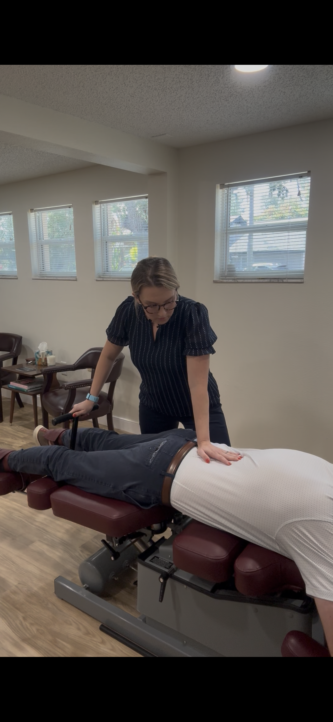 Dr. Jen Baylor while doing flexion distraction therapy on a patient. 