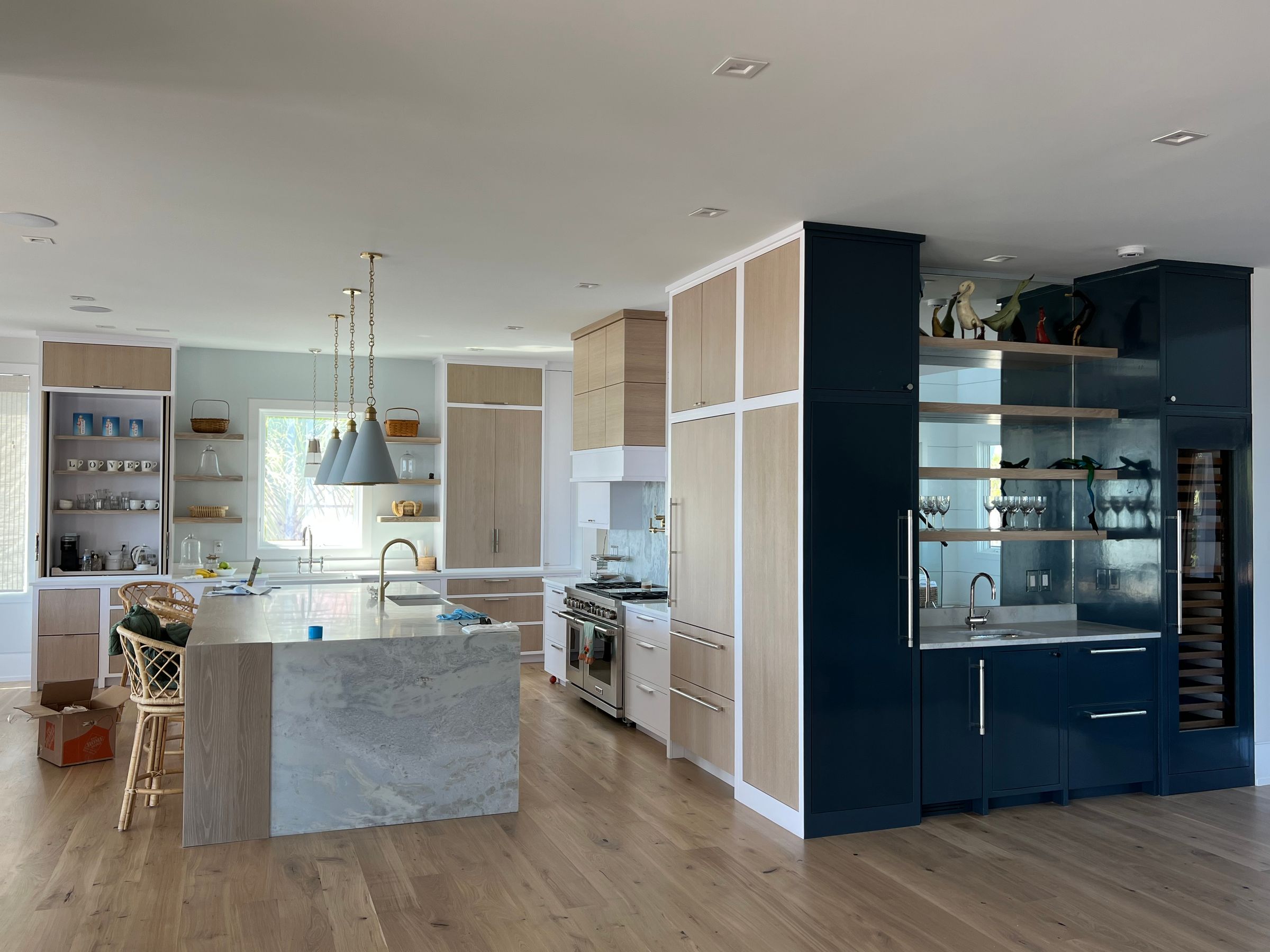 Rift Cut white oak doors, painted faceframes. Massena Homes, Artistic 