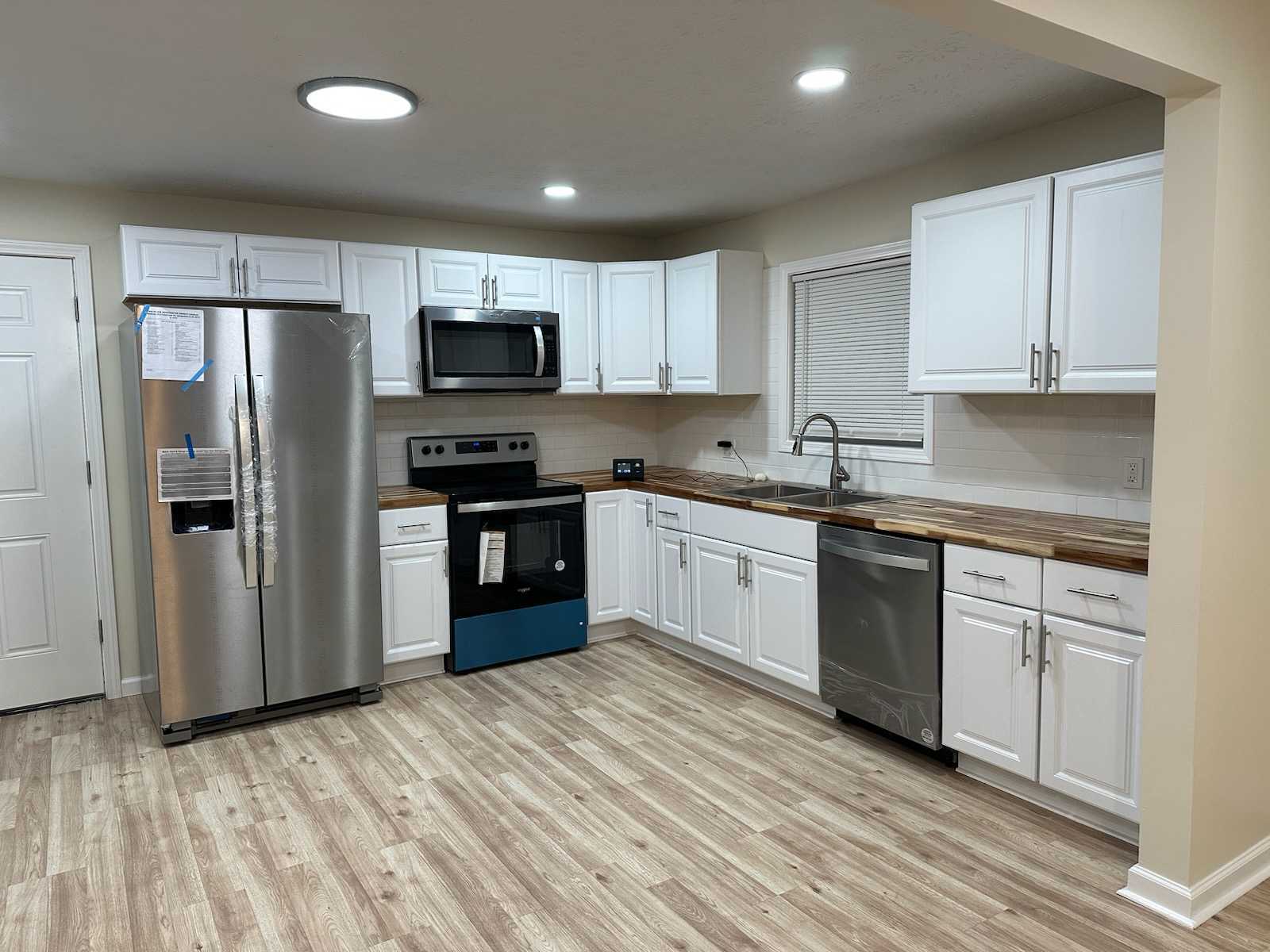 installed kitchen cabinets and backsplash 