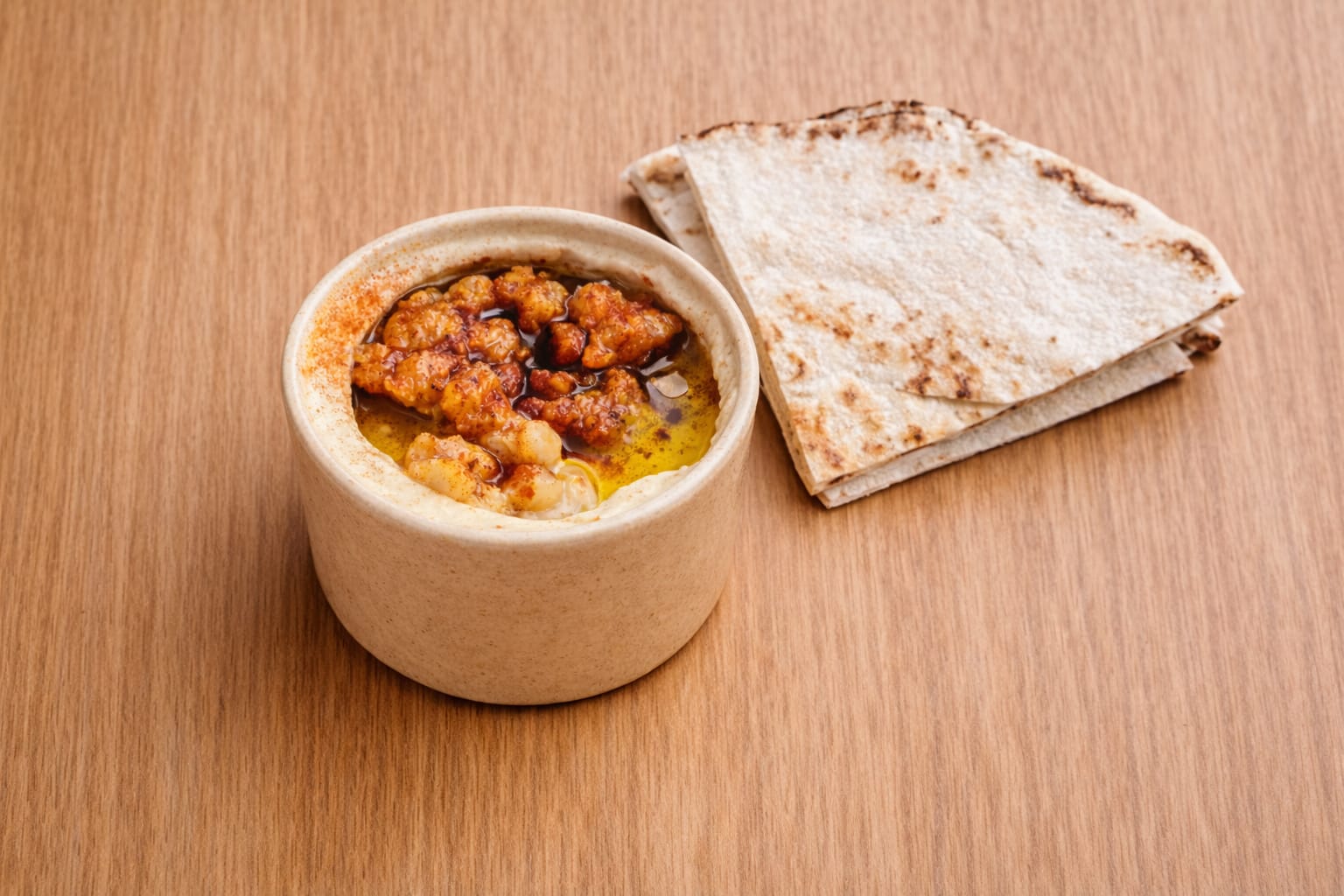 served with whole chickeas, a pinch of paprika, and extra virgin olive oil