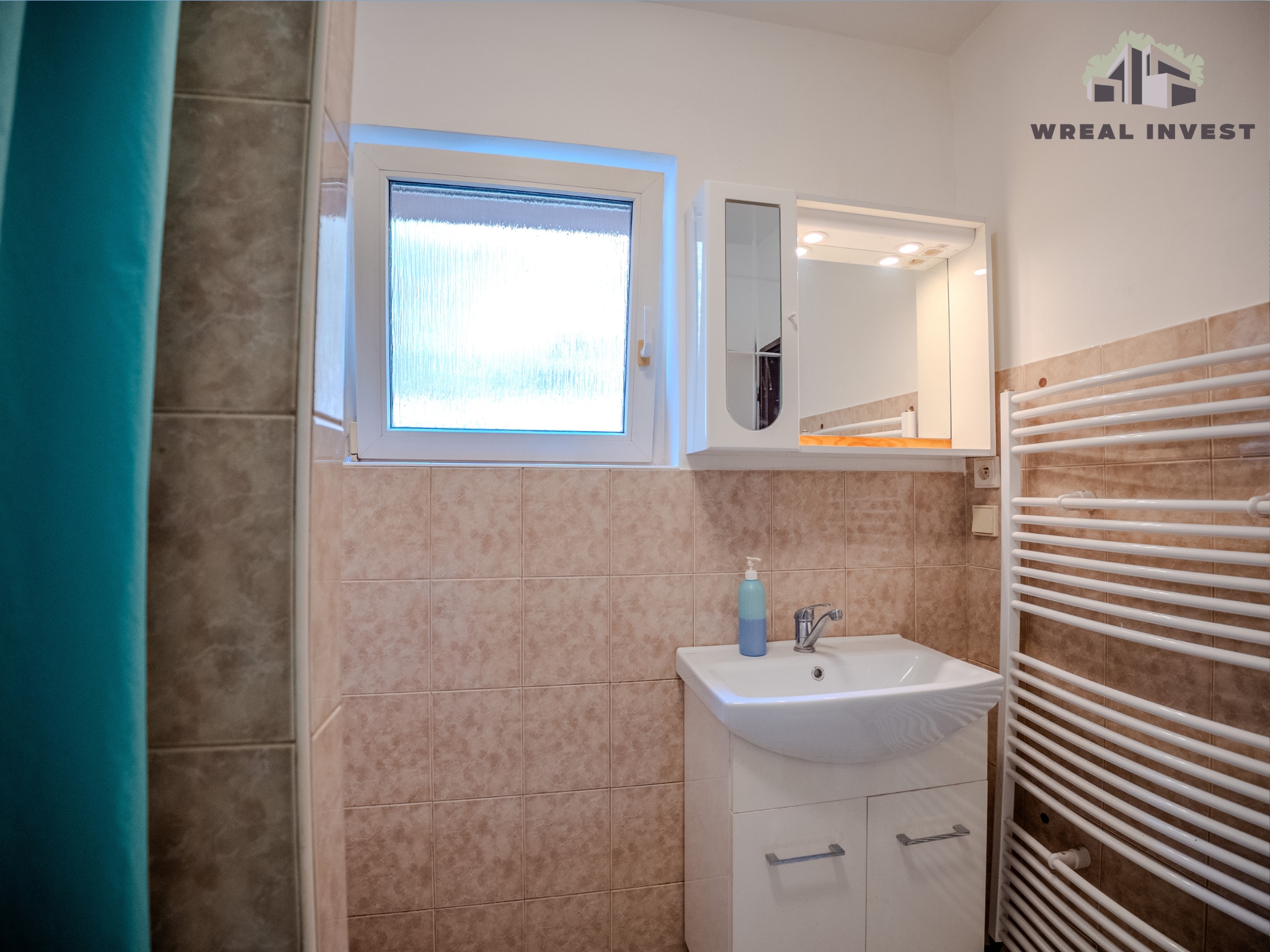 WREAL INVEST's image