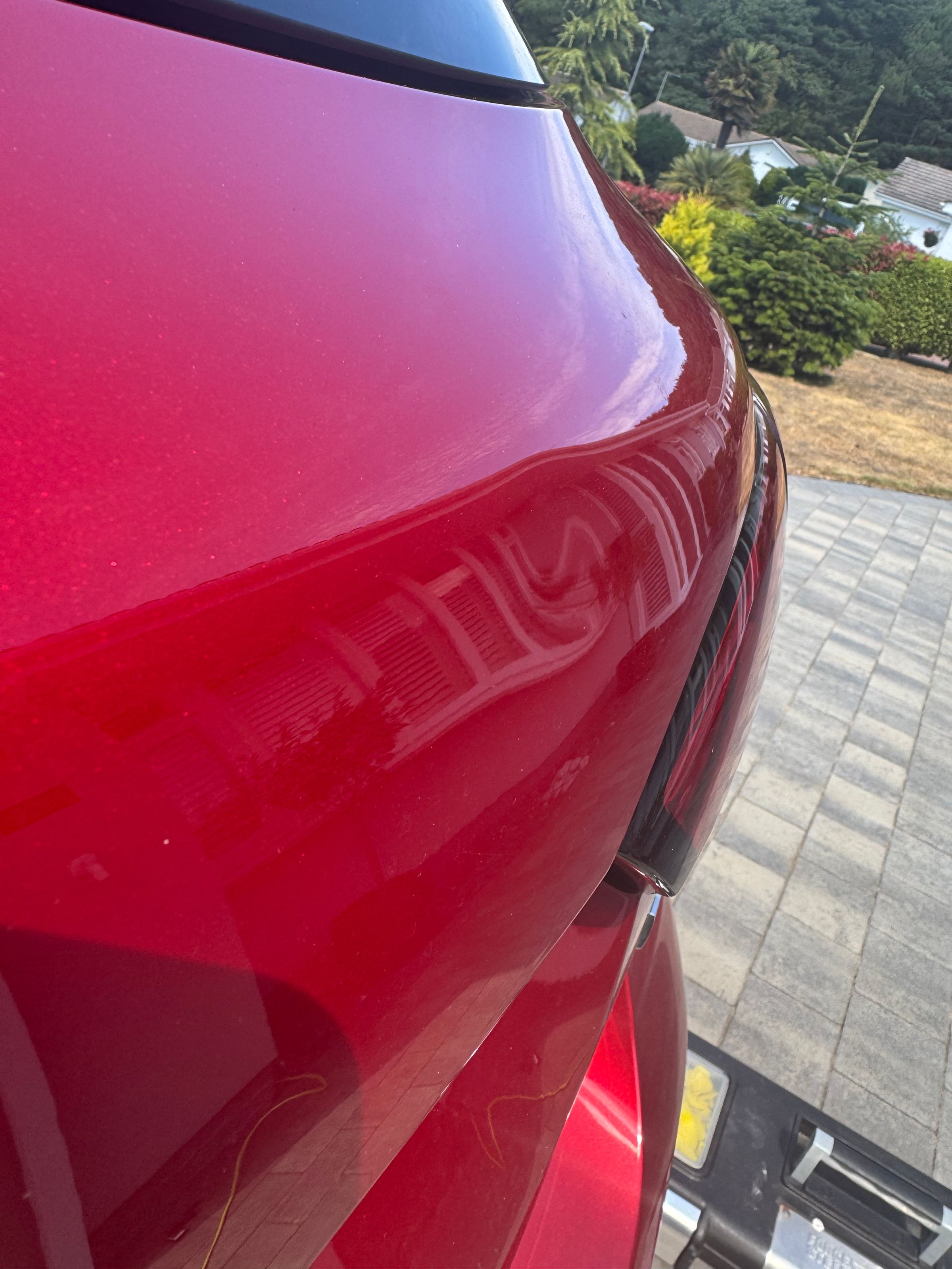 Some shallow dents in a boot of a MG