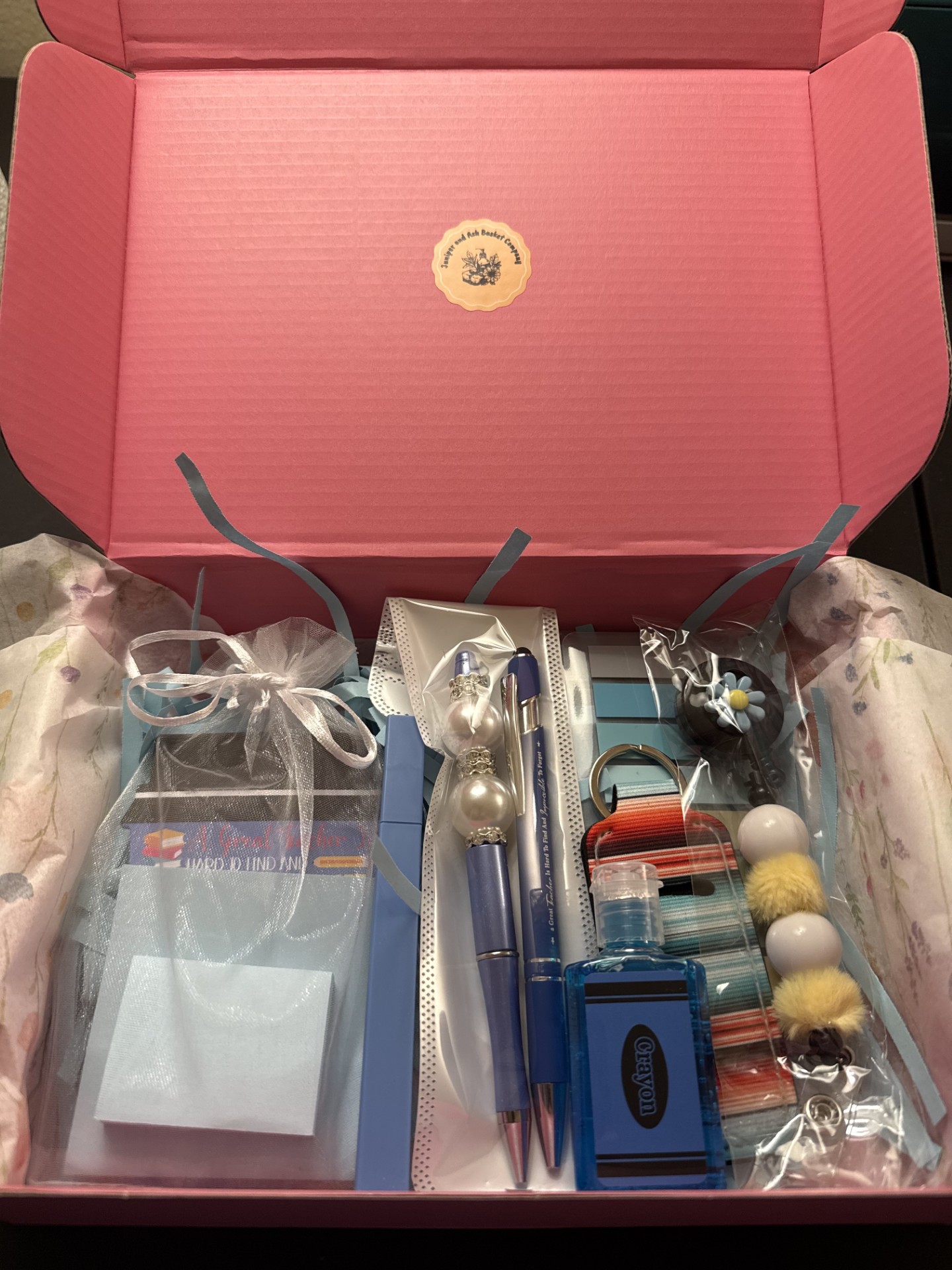 Sticky notes, highlighter, beaded pen, teacher pen, hand sanitizer, book tabs, chapstick holder, beaded badge reel