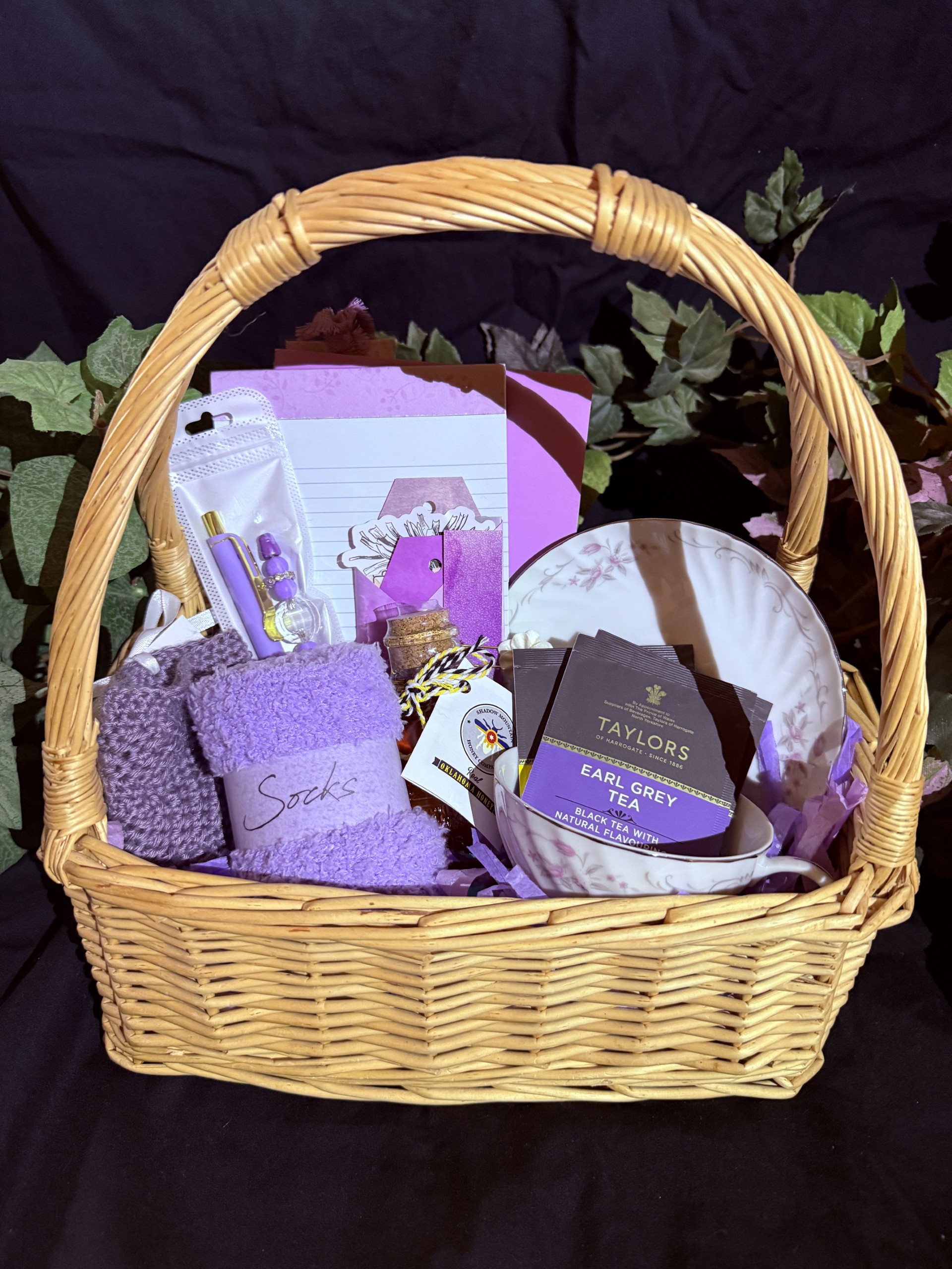 Notebooks, pens, journal, socks, tea cup and tea, honey, cozy