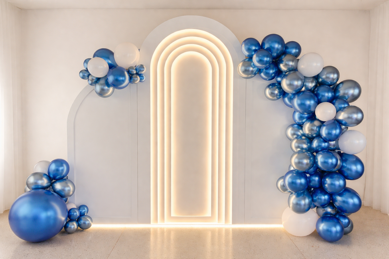 A fresh and vibrant look with bold blue balloon accents against our classic white arch. Great for birthdays, baby showers, and celebrations that call for a fun pop of color.