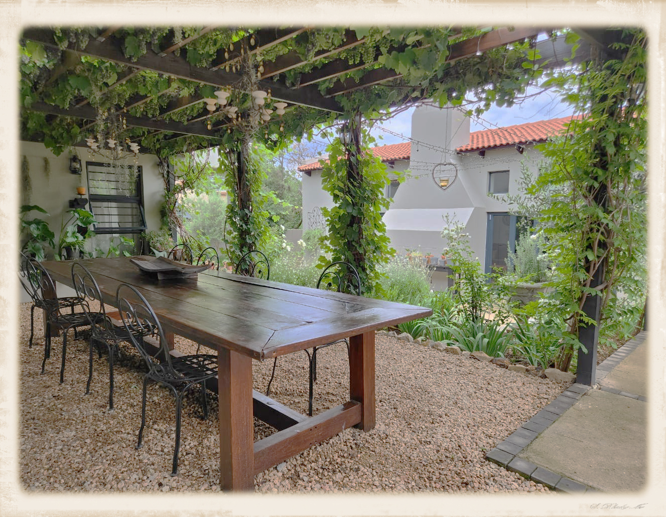 One of our favourite recreational areas, our long table under the pergola covered with grapes