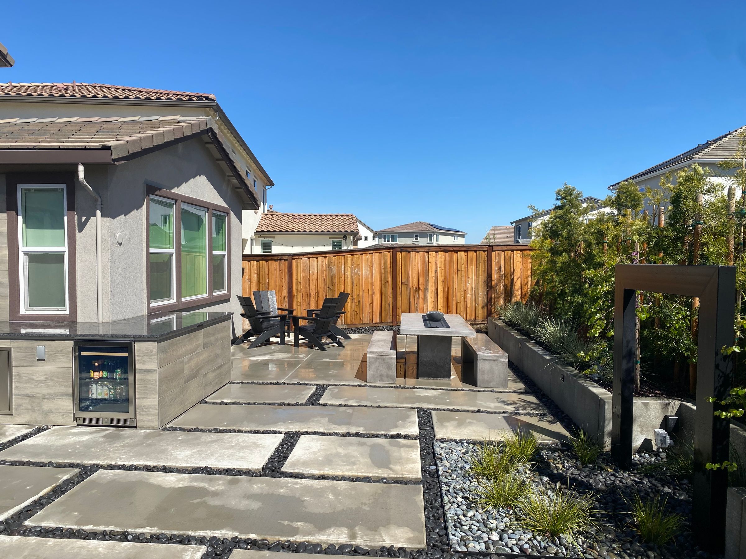 CONCRETE PATIO WITH MEXICAN BEACH PEBBLE