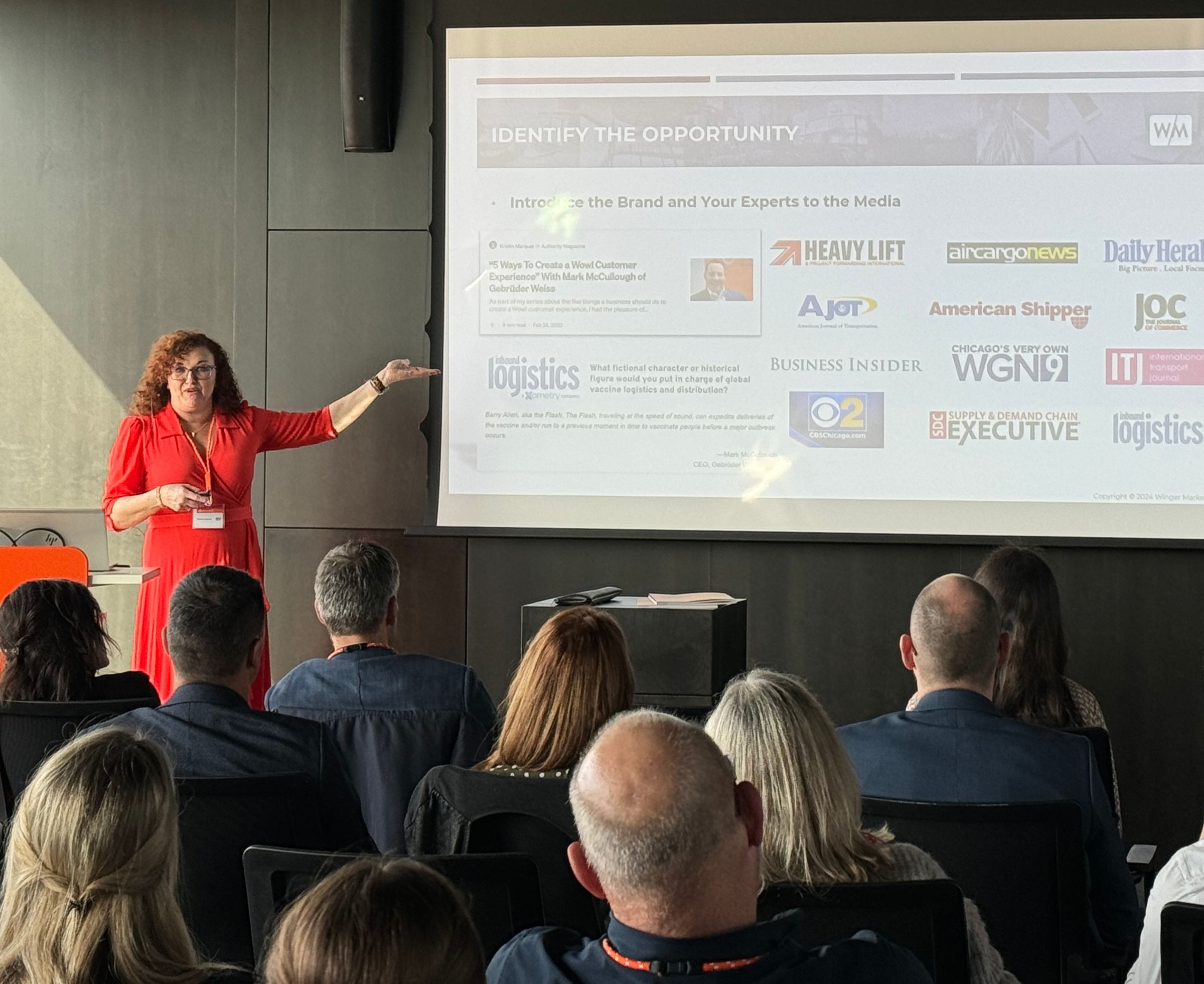 Karolyn Raphael explains a strategic marketing plan at a client's international marketing summit.